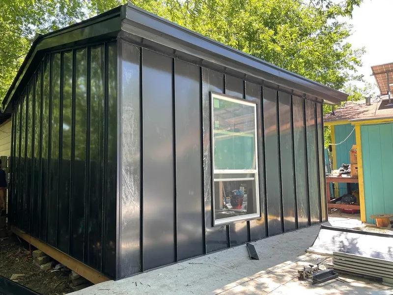 Black standing seam metal wall panels for Roof Inspection in Vienna